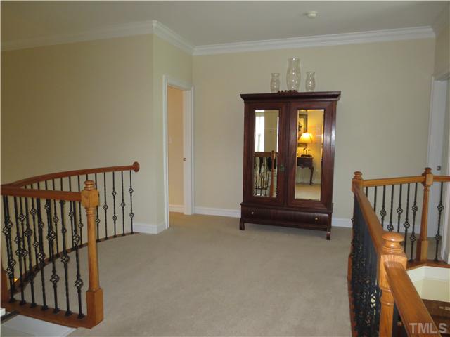 2324 Clayette Court Raleigh, NC 27612 - Photo 18 of 25 a view of a hallway with entryway and furniture