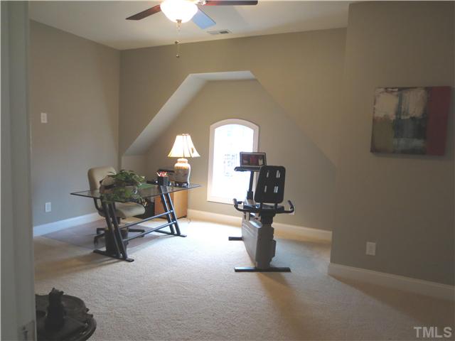 2324 Clayette Court Raleigh, NC 27612 - Photo 20 of 25 a living room with furniture and a lamp