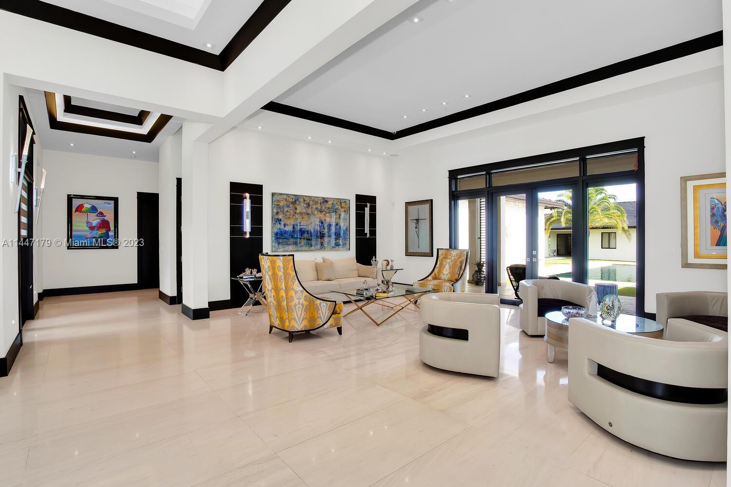 11880 Southwest 47th Street Miami, FL 33175 - Photo 13 of 61 a living room with furniture and a large window