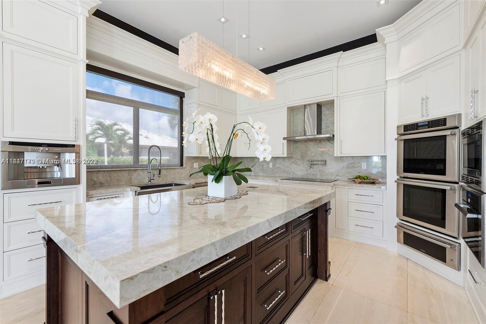 11880 Southwest 47th Street Miami, FL 33175 - Photo 15 of 61 a kitchen with a center island and cabinets