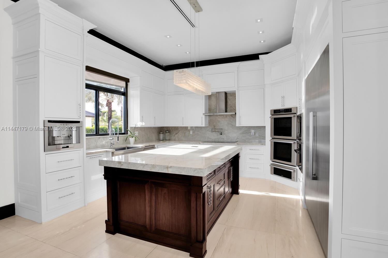 11880 Southwest 47th Street Miami, FL 33175 - Photo 16 of 61 a kitchen with a stove and a refrigerator
