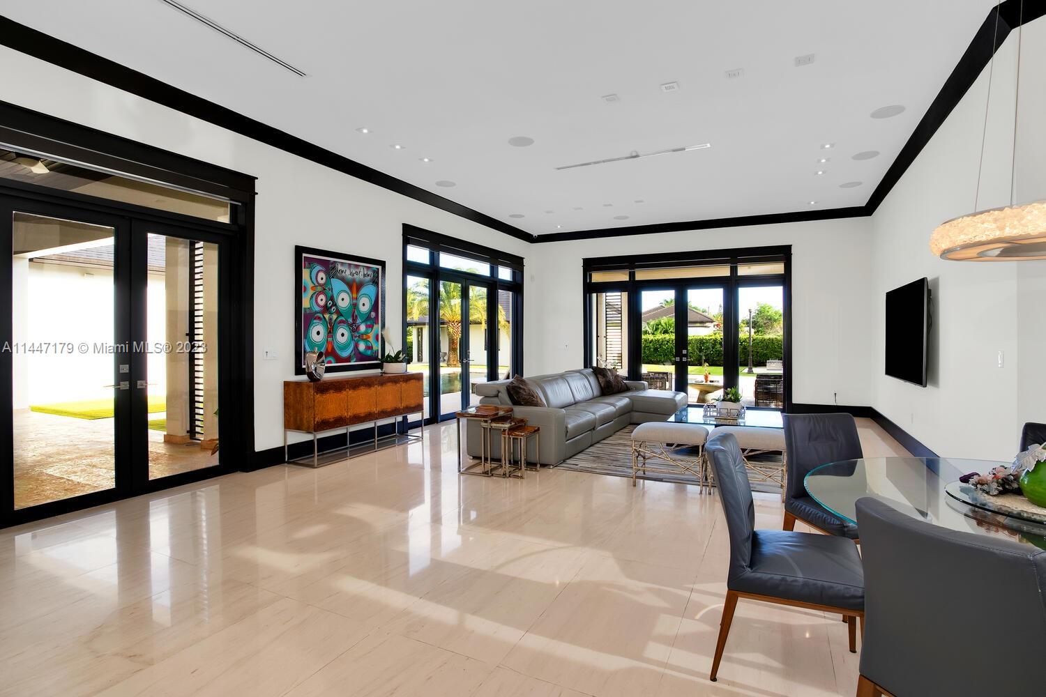 11880 Southwest 47th Street Miami, FL 33175 - Photo 21 of 61 a living room with furniture and a flat screen tv