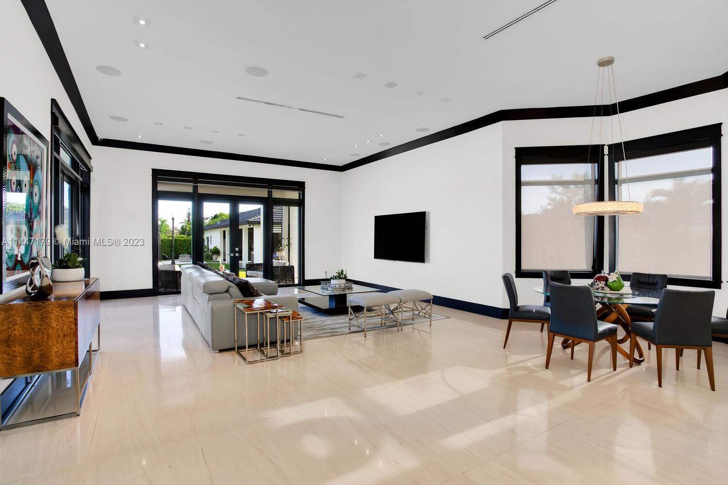 11880 Southwest 47th Street Miami, FL 33175 - Photo 22 of 61 a living room with furniture and large window