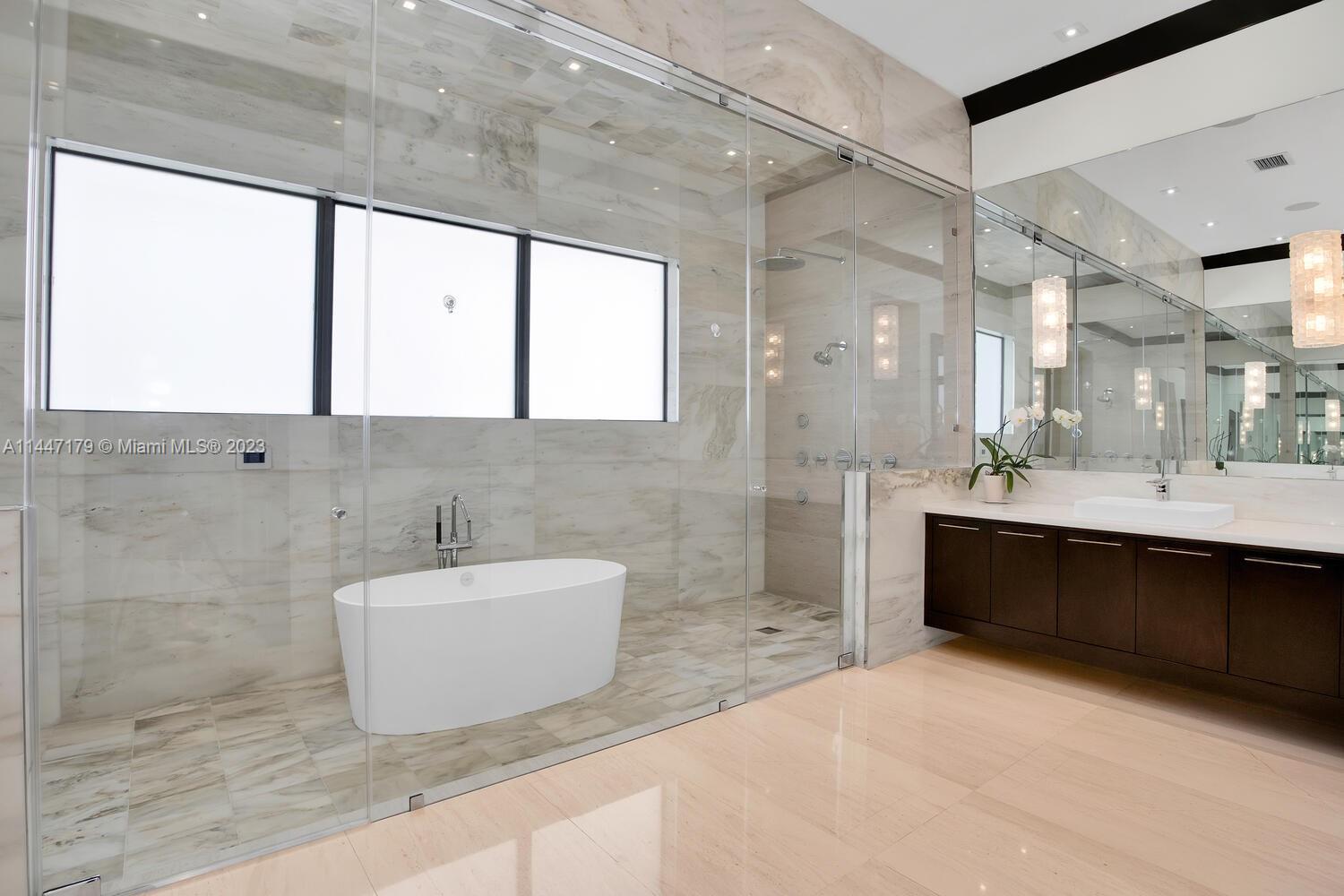 11880 Southwest 47th Street Miami, FL 33175 - Photo 27 of 61 a spacious bathroom with a bathtub and a sink