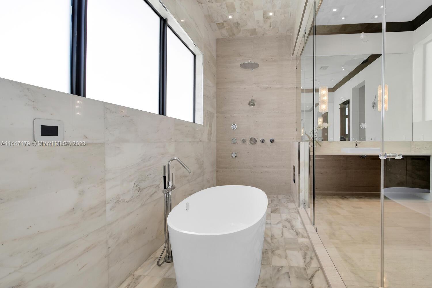 11880 Southwest 47th Street Miami, FL 33175 - Photo 28 of 61 a bathroom with a sink a toilet a mirror and shower