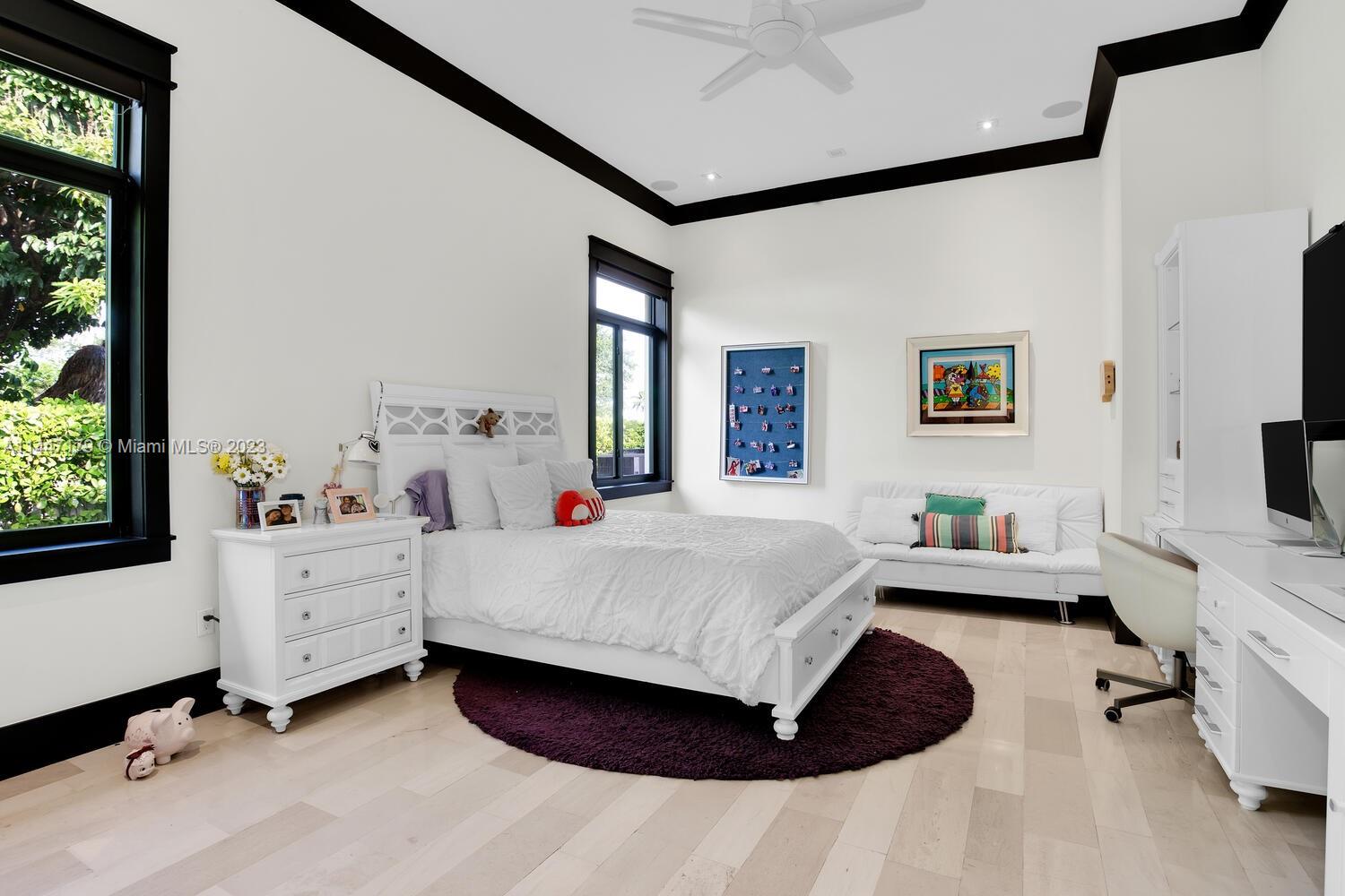 11880 Southwest 47th Street Miami, FL 33175 - Photo 30 of 61 a room with a bed and a flat screen tv