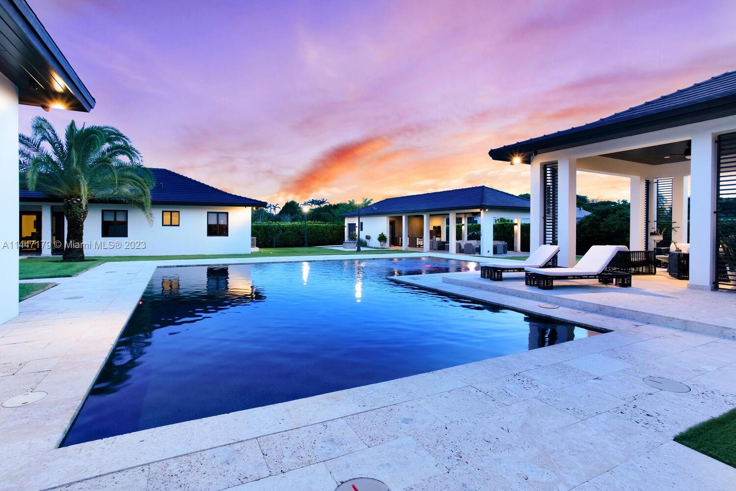 11880 Southwest 47th Street Miami, FL 33175 - Photo 3 of 61 a view of a house with swimming pool and sitting area