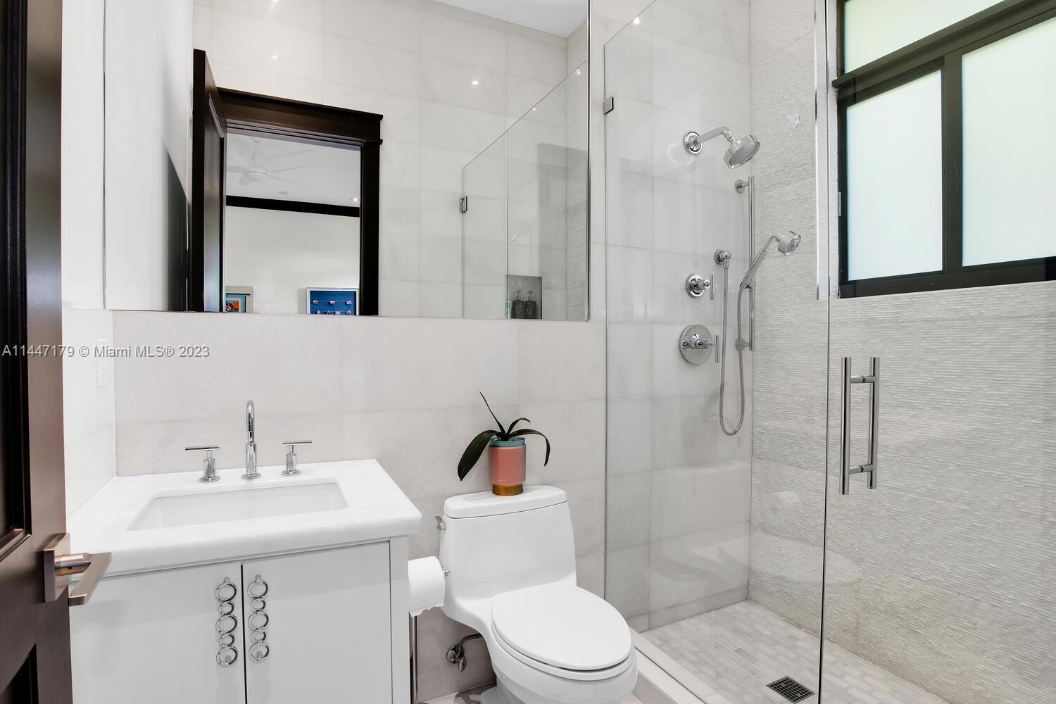 11880 Southwest 47th Street Miami, FL 33175 - Photo 31 of 61 a bathroom with a sink toilet and shower