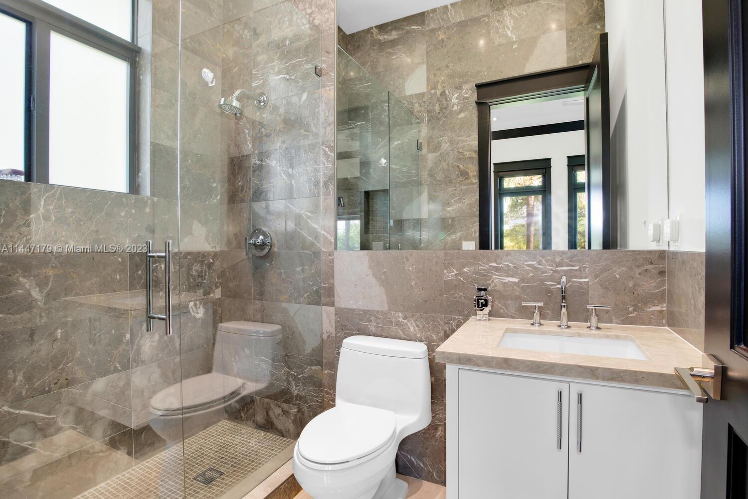 11880 Southwest 47th Street Miami, FL 33175 - Photo 34 of 61 a bathroom with a sink toilet and shower