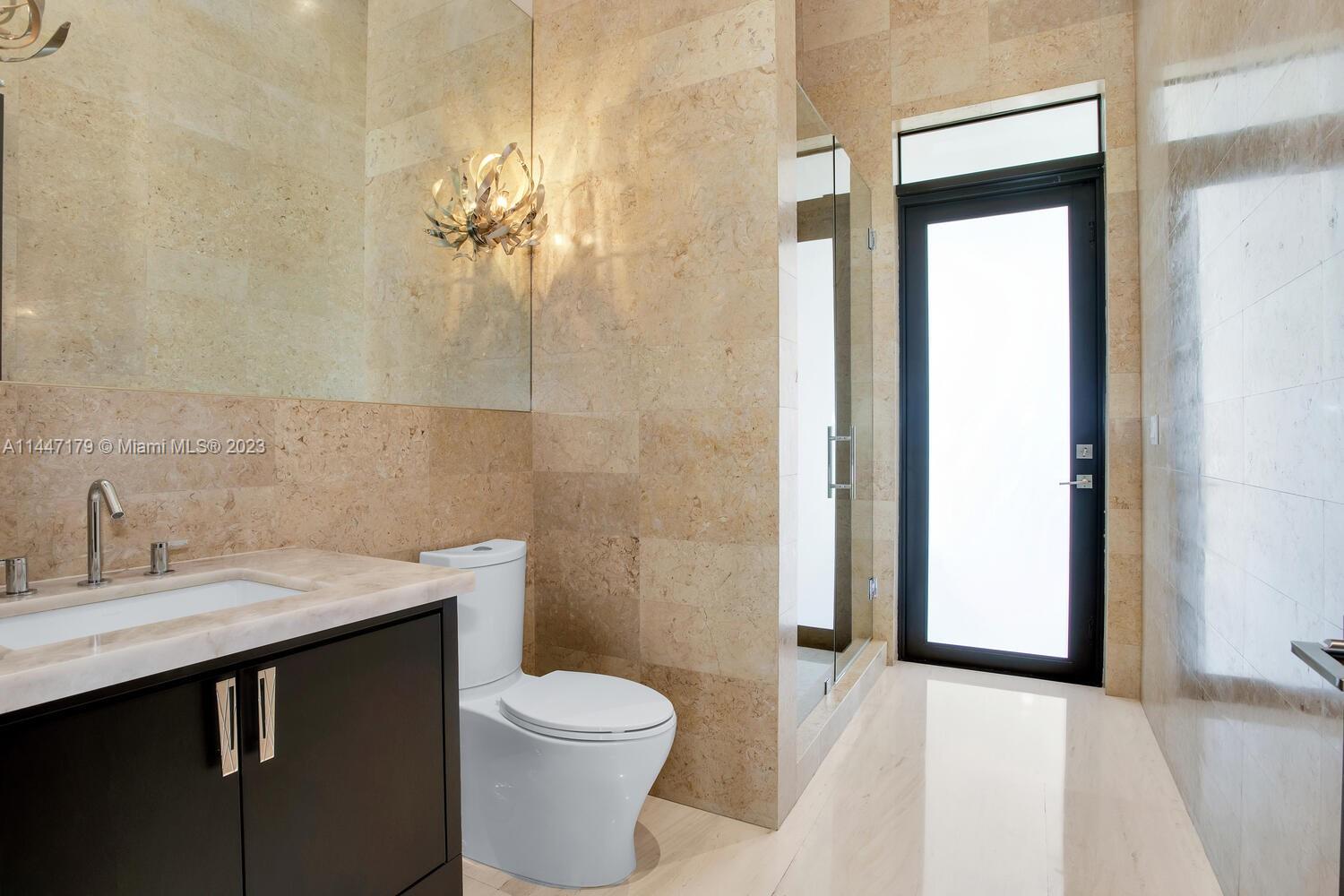 11880 Southwest 47th Street Miami, FL 33175 - Photo 36 of 61 a bathroom with a sink a toilet and shower