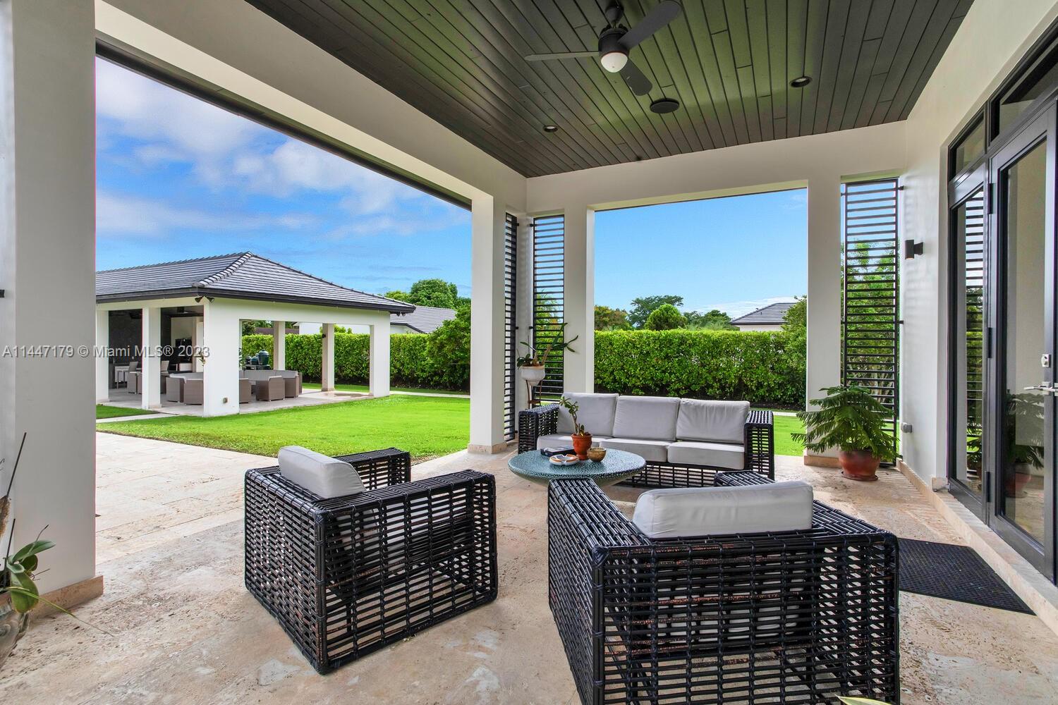 11880 Southwest 47th Street Miami, FL 33175 - Photo 42 of 61 a view of an house with backyard porch and patio