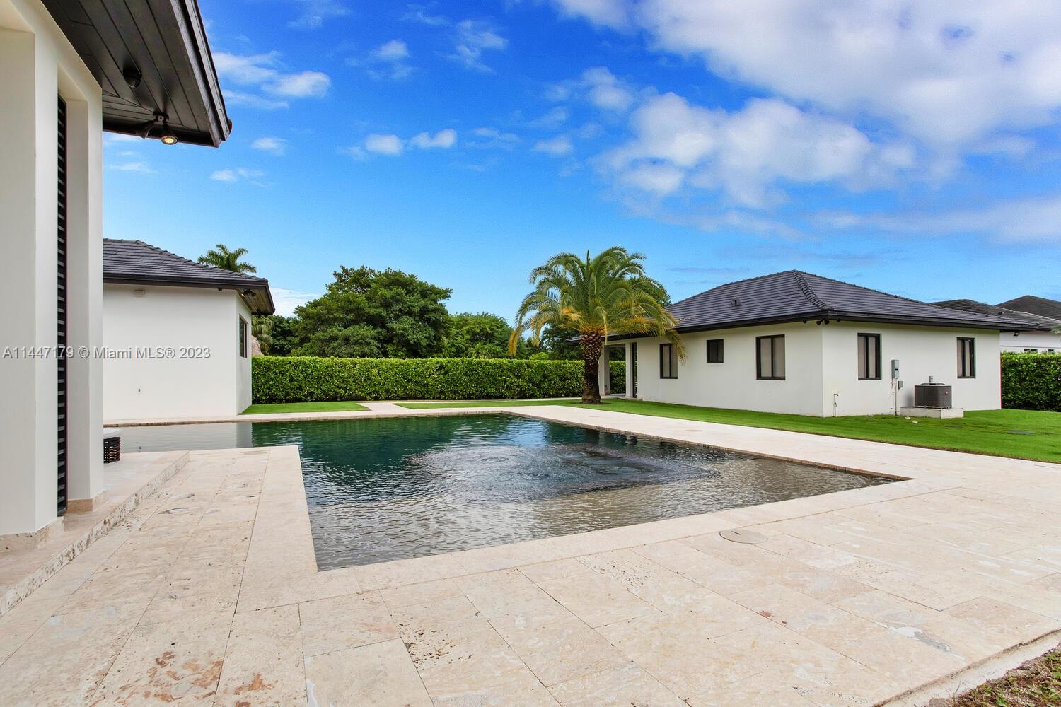 11880 Southwest 47th Street Miami, FL 33175 - Photo 43 of 61 a front view of a house with a yard