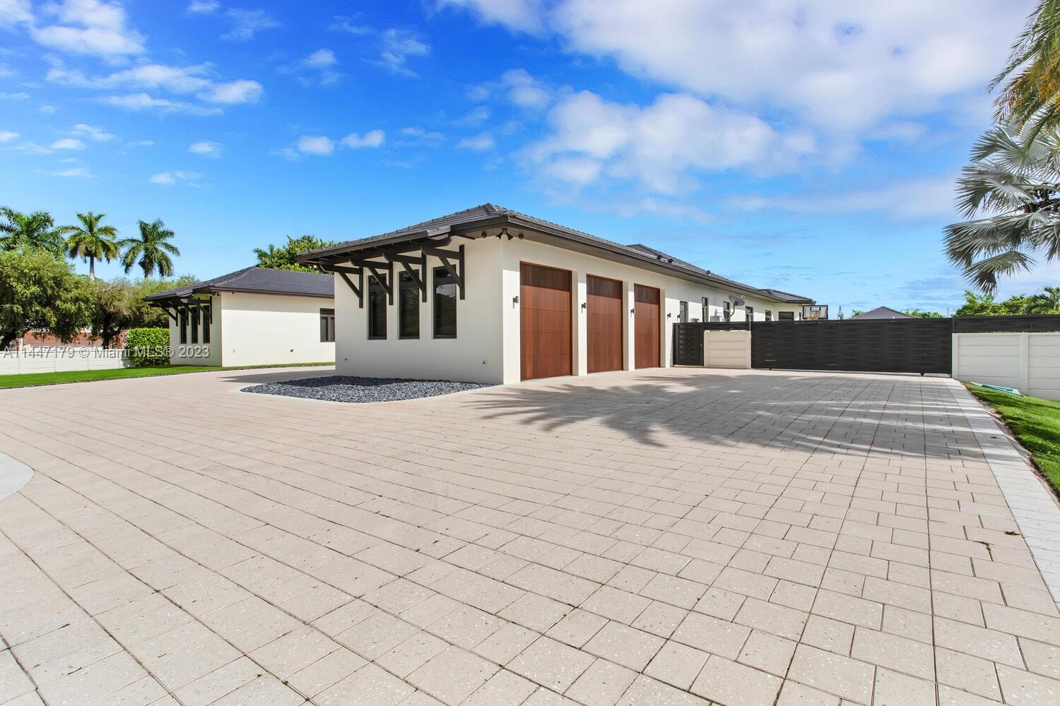 11880 Southwest 47th Street Miami, FL 33175 - Photo 49 of 61 a front view of a house with a yard