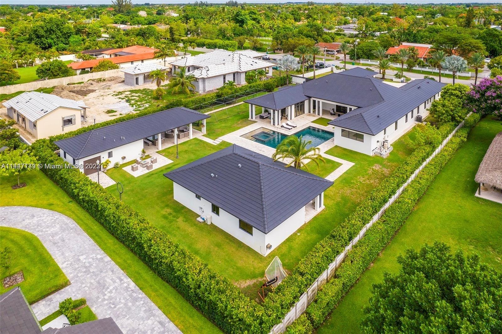 11880 Southwest 47th Street Miami, FL 33175 - Photo 60 of 61 an aerial view of a house with a garden