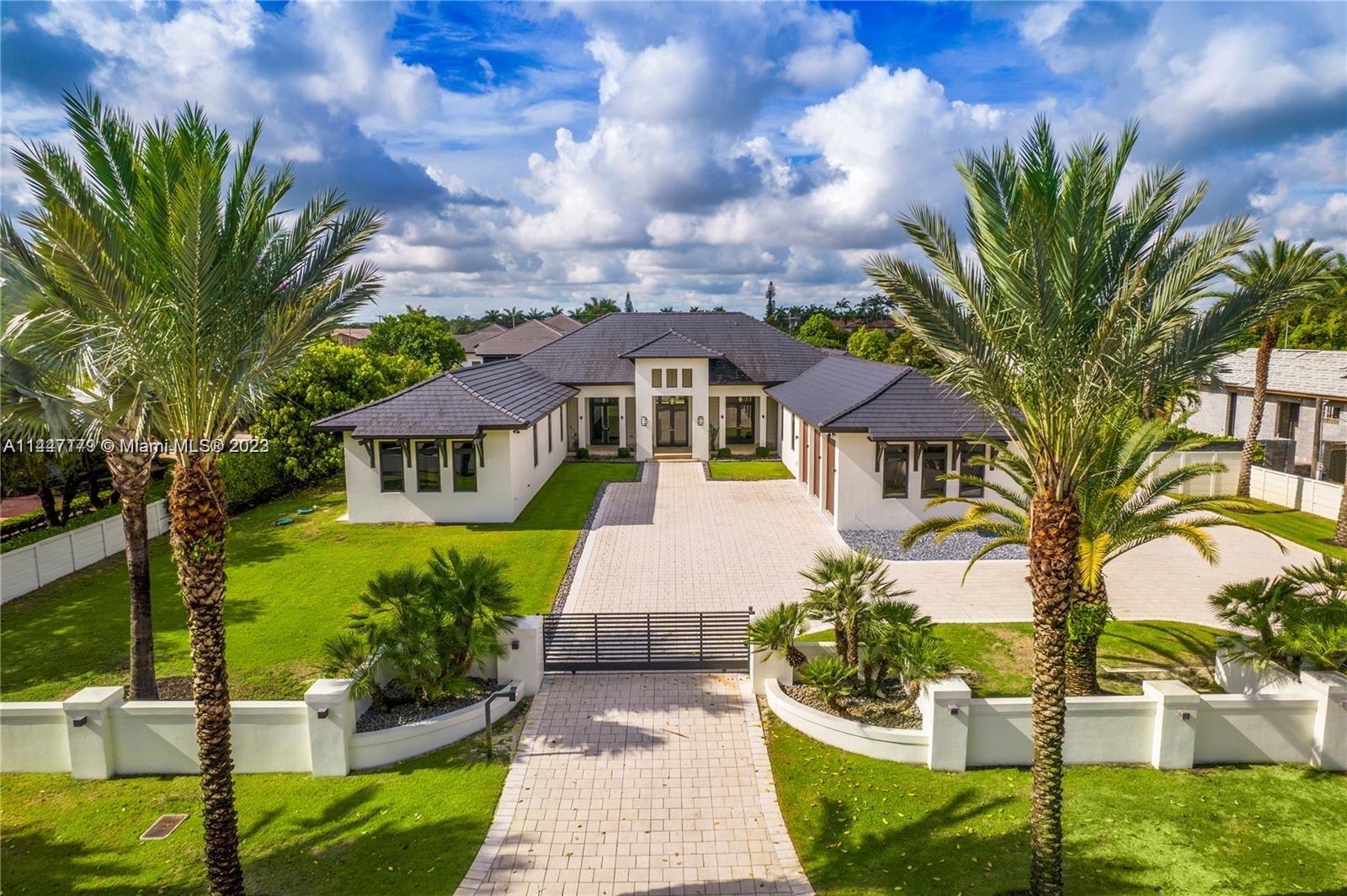 11880 Southwest 47th Street Miami, FL 33175 - Photo 61 of 61 a front view of a house with a yard