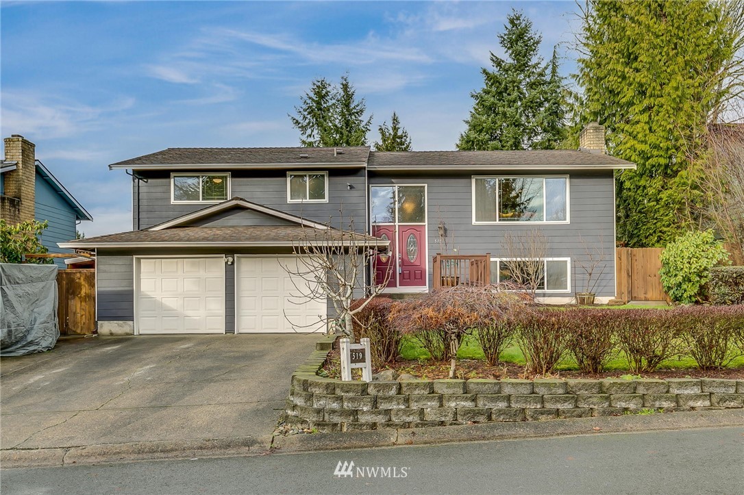 519 213th Place Southwest Bothell, WA 98021 - Photo 1 of 34 front view of a house with a yard