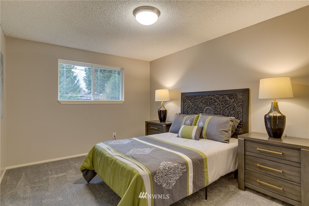 519 213th Place Southwest Bothell, WA 98021 - Photo 18 of 34 a bedroom with a bed and window