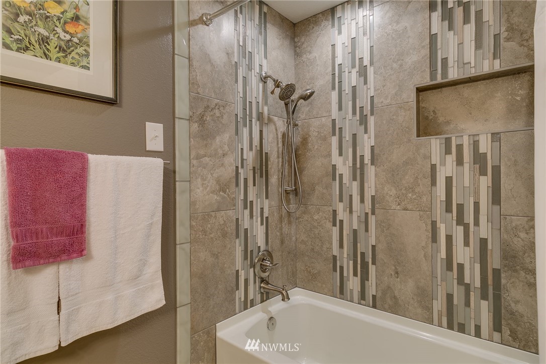 519 213th Place Southwest Bothell, WA 98021 - Photo 20 of 34 a bathroom with a tub and shower