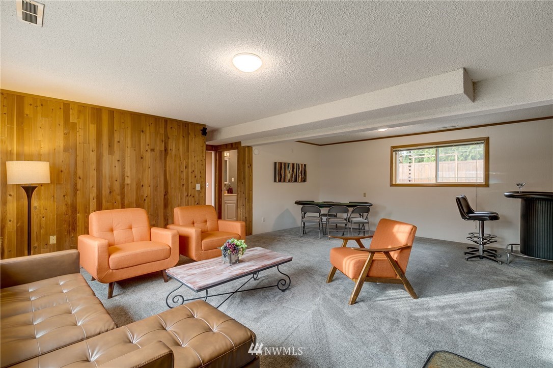519 213th Place Southwest Bothell, WA 98021 - Photo 21 of 34 a living room with furniture and a window