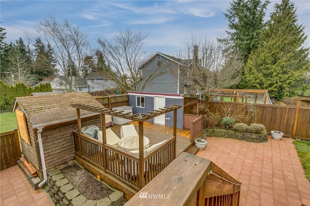 519 213th Place Southwest Bothell, WA 98021 - Photo 28 of 34 a view of a house with backyard and deck