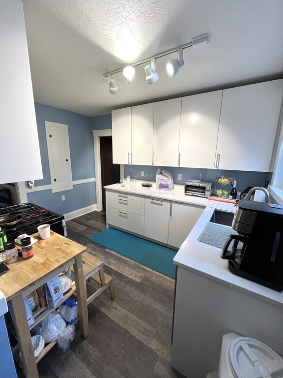 16-18 Oak Hill Road, Unit 1 Waltham, MA 02451 - Photo 7 of 11 a kitchen with a stove a sink dishwasher and a refrigerator