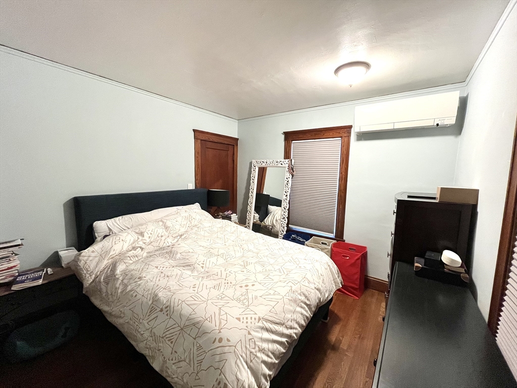 16-18 Oak Hill Road, Unit 1 Waltham, MA 02451 - Photo 9 of 11 a bedroom with a bed and dresser