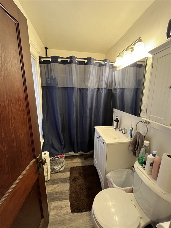 16-18 Oak Hill Road, Unit 1 Waltham, MA 02451 - Photo 10 of 11 a bathroom with a toilet and a shower