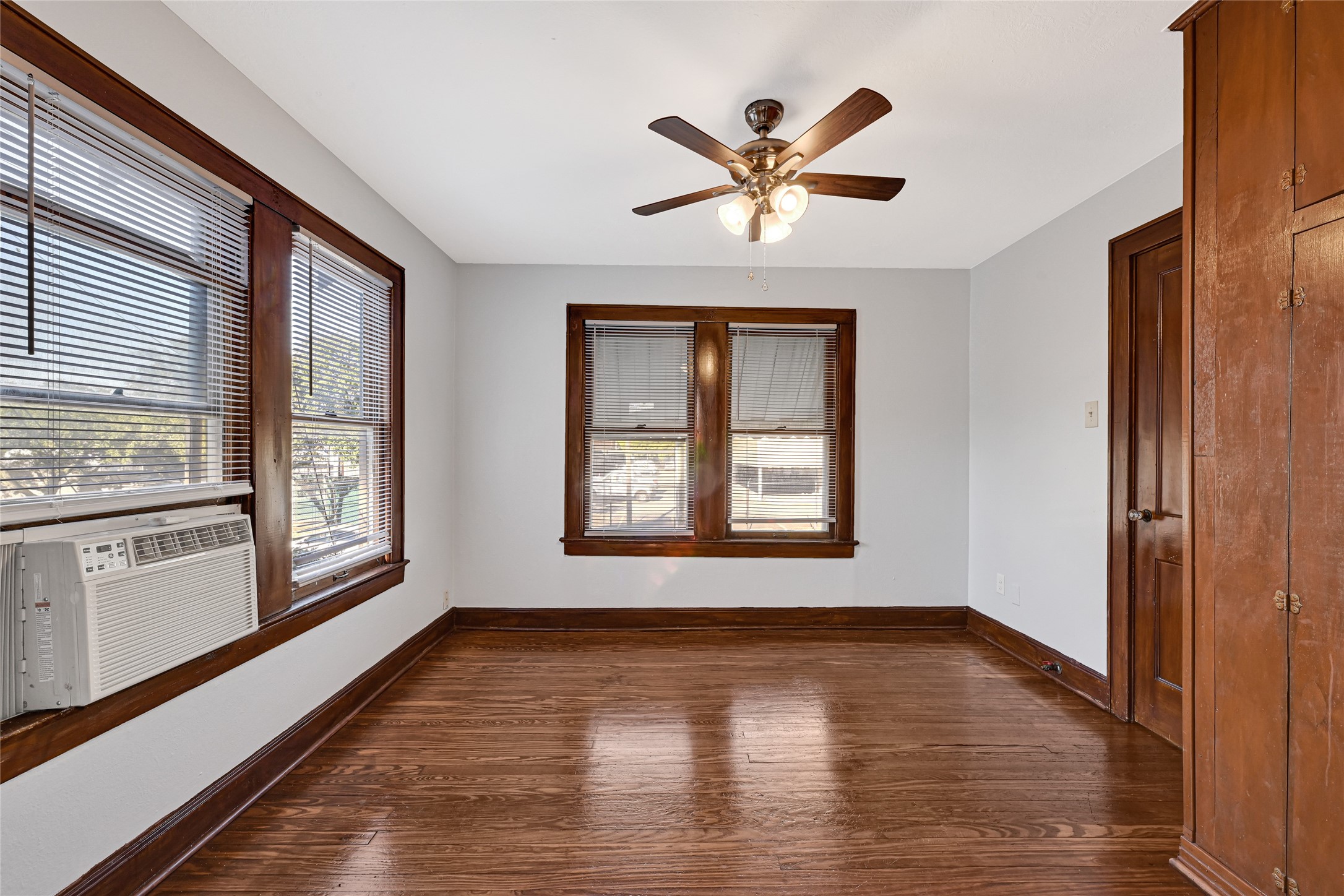 1707 Sidney Street Houston, TX 77023 - Photo 3 of 6 a view of an empty room with a window and wooden floor