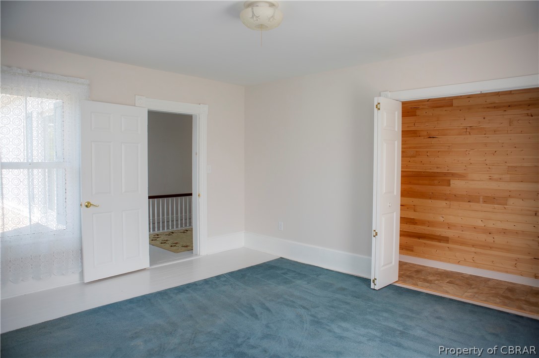 8669 Guinea Road Hayes, VA 23072 - Photo 42 of 49 Upstairs Bedroom with cedar lined closet
