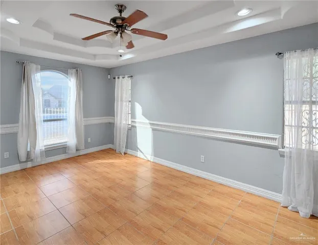 a view of a kitchen with a sink a refrigerator and a window