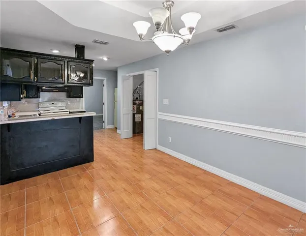 a kitchen with a sink cabinets and window