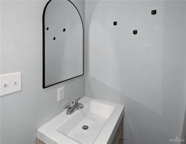 a bathroom with a toilet and a sink