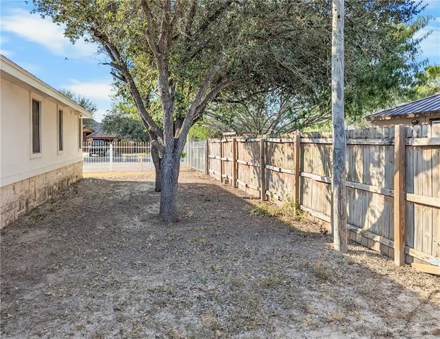 a view of outdoor space with deck and tree