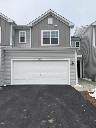 a view of a house with a garage