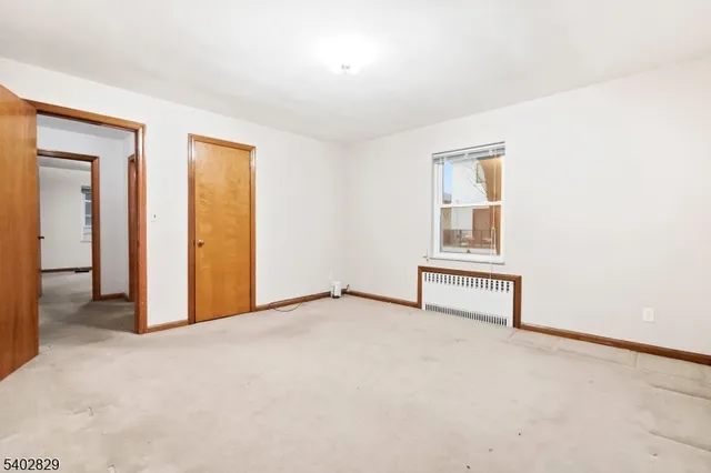 a view of an empty room with a birdcage