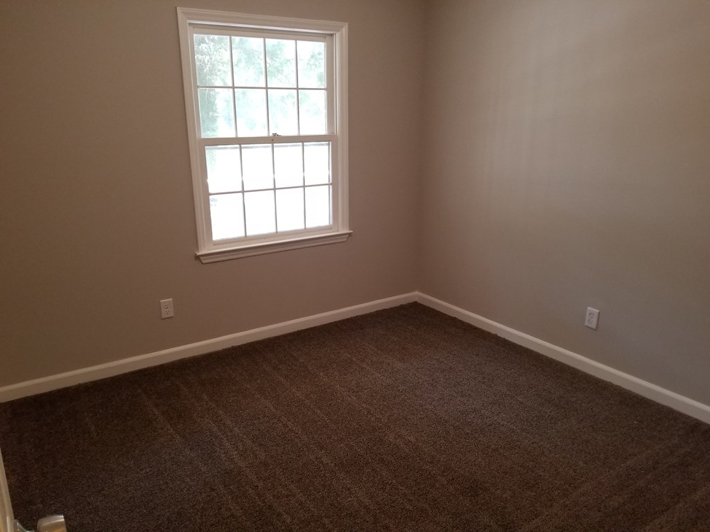 10089 County Line Road Midland, GA 31820 - Photo 16 of 27 an empty room with a window