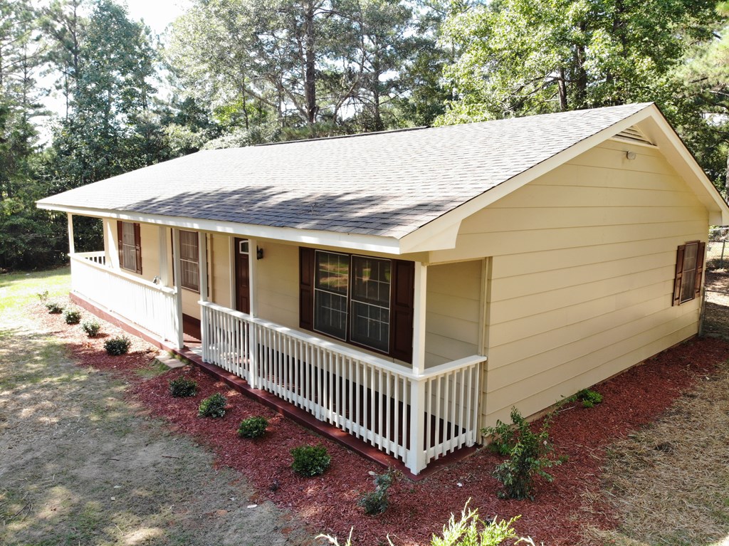 10089 County Line Road Midland, GA 31820 - Photo 2 of 27 a back yard of a house