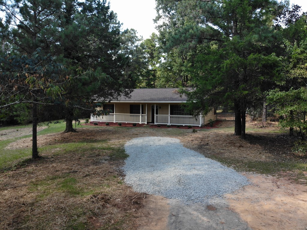 10089 County Line Road Midland, GA 31820 - Photo 4 of 27 a front view of a house with a yard
