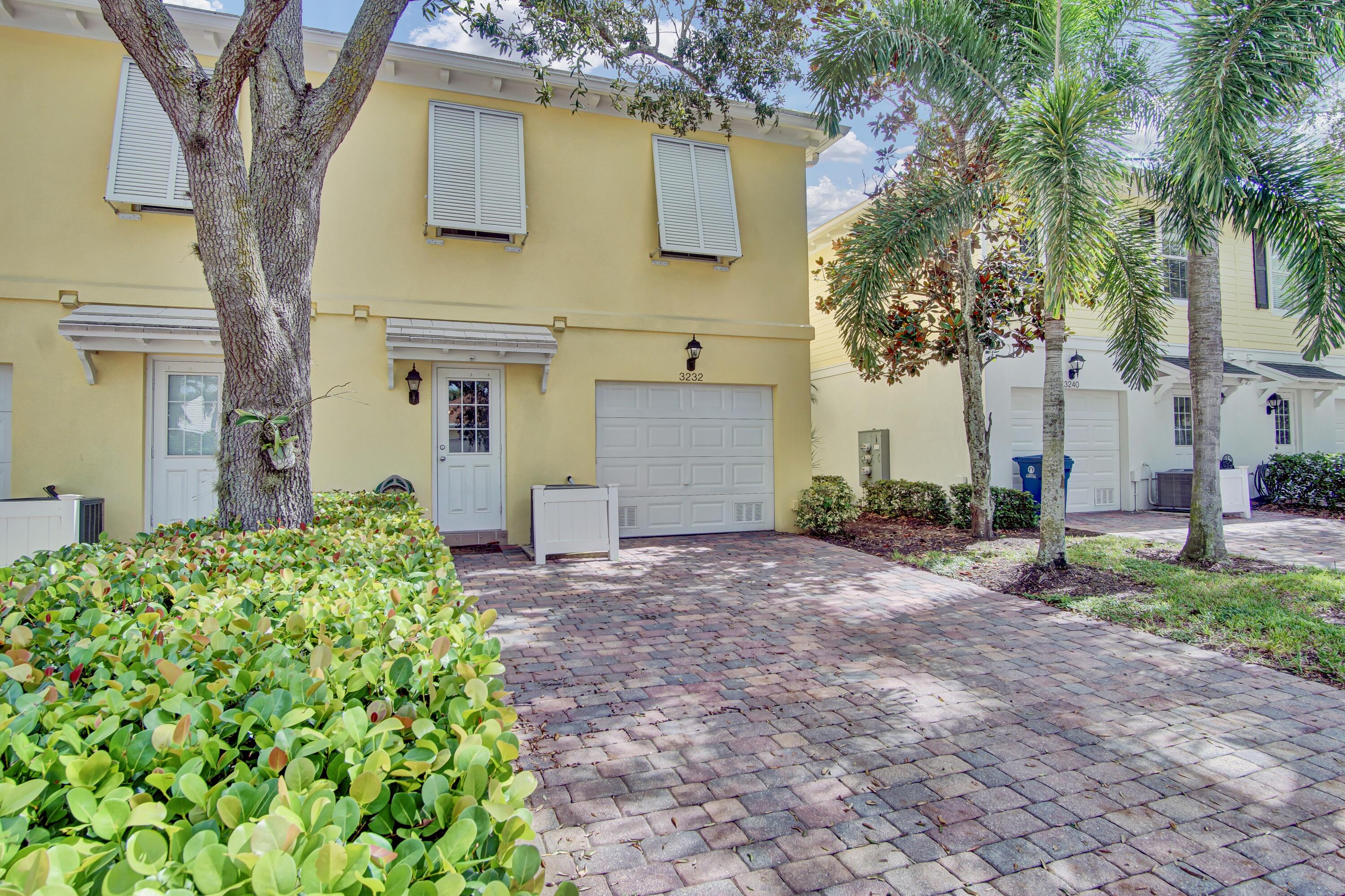 3232 West Community Drive Jupiter, FL 33458 - Photo 40 of 51 Rear Exterior Garage