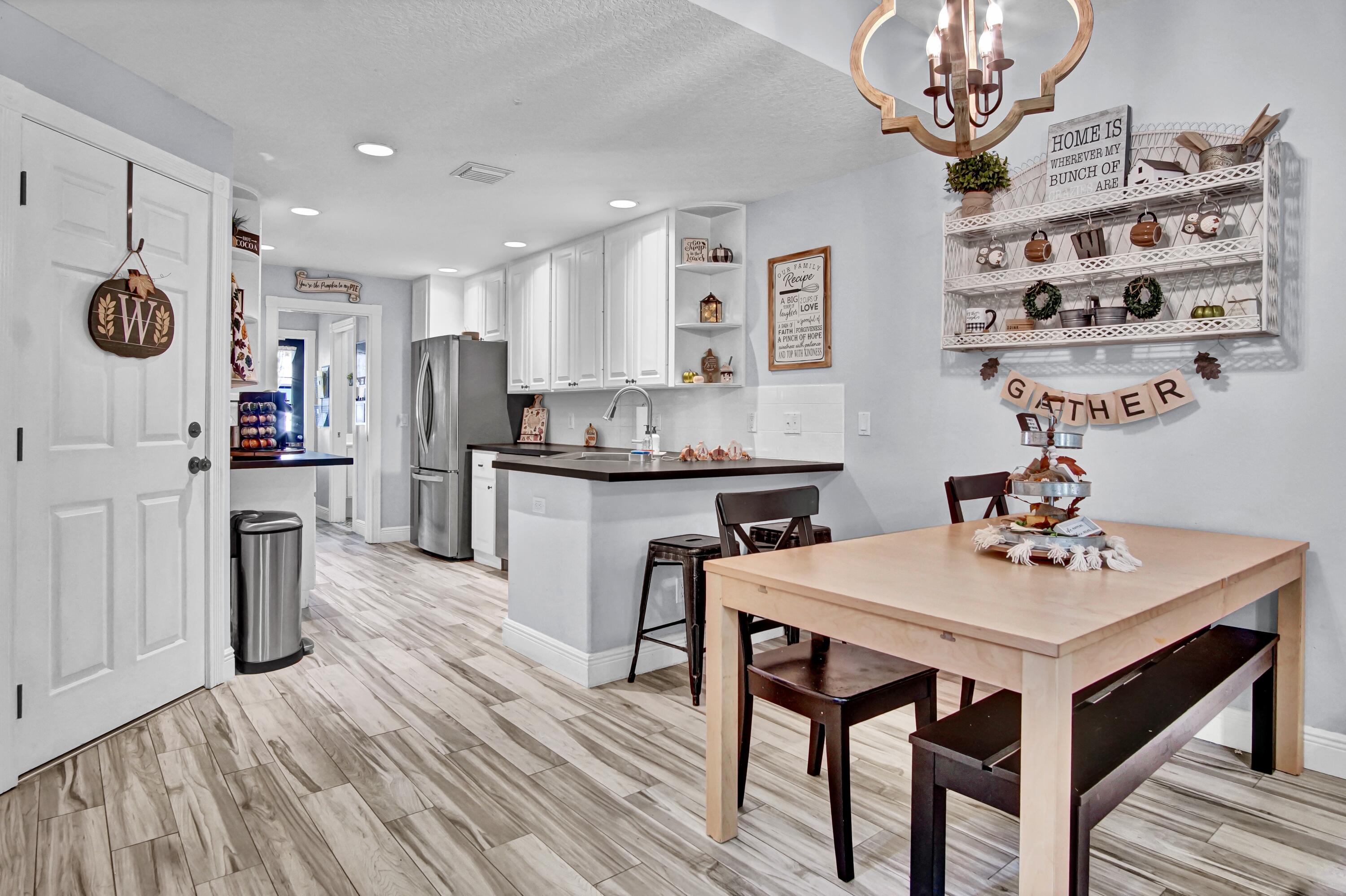 3232 West Community Drive Jupiter, FL 33458 - Photo 8 of 51 Dining to Kitchen