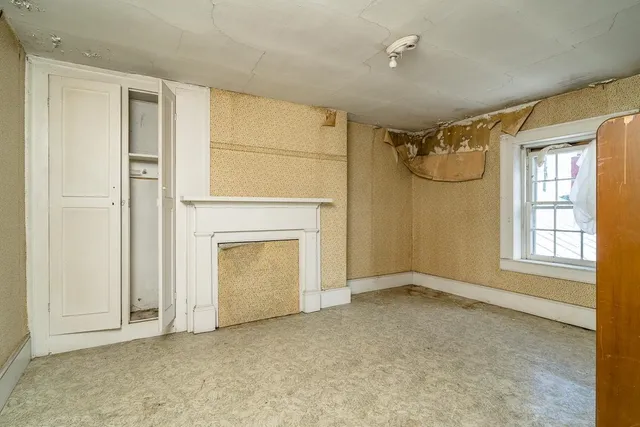 a bathroom with a bathtub and a window