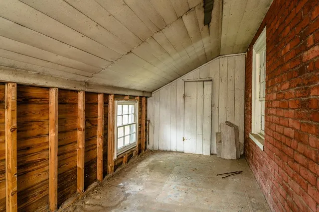a view of a bedroom with natural light