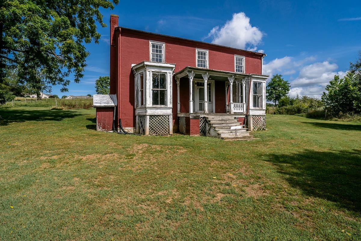 5787 Borden Grant Trail Raphine, VA 24472 - Photo 23 of 52 a front view of a house with garden