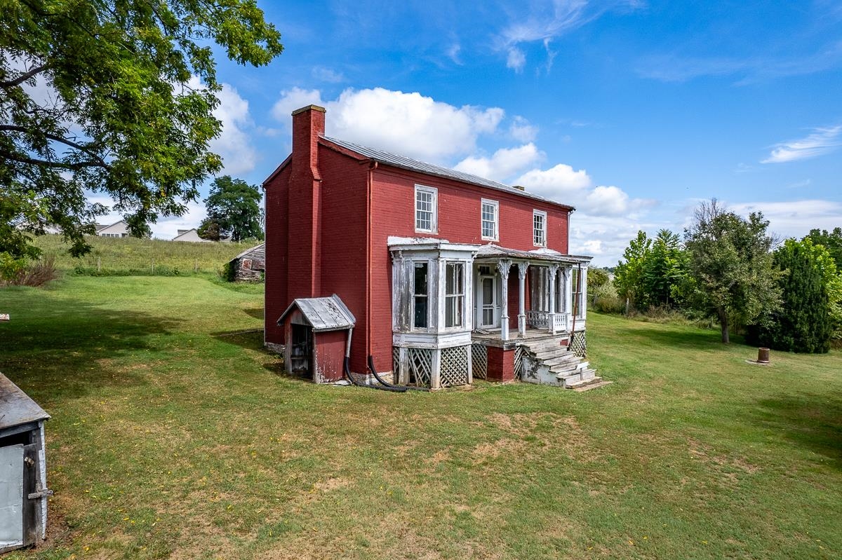 5787 Borden Grant Trail Raphine, VA 24472 - Photo 26 of 52 a view of a house with a yard porch and sitting area