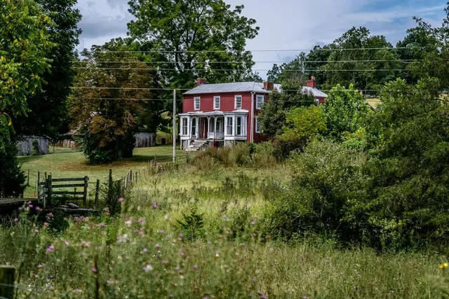 an aerial view of a house with a garden