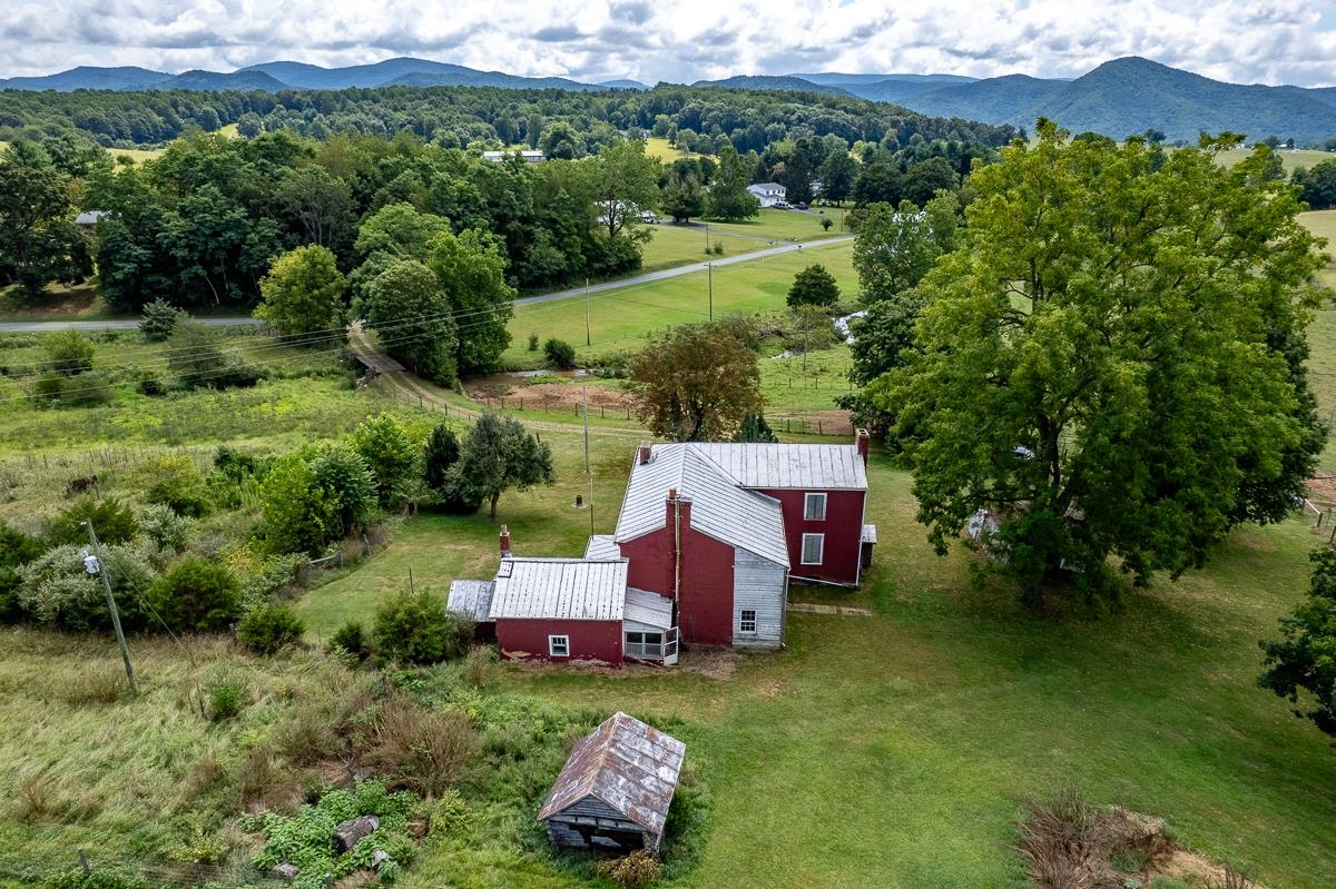 5787 Borden Grant Trail Raphine, VA 24472 - Photo 34 of 52 an aerial view of a house with a yard and lake view