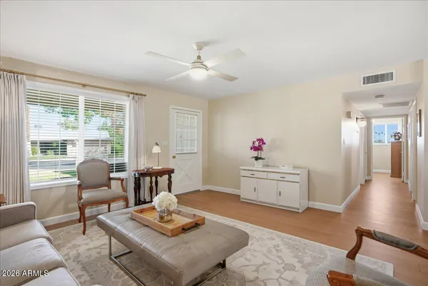 a living room with furniture and a large window