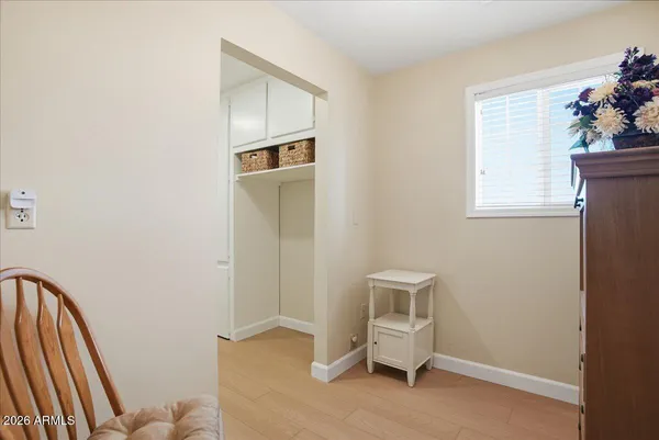 a bedroom with a large bed and a window