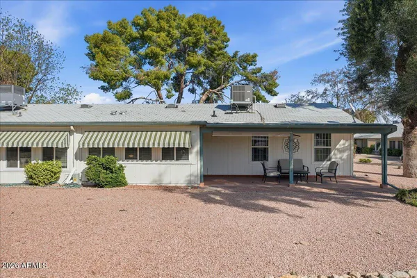 a front view of a house with a patio