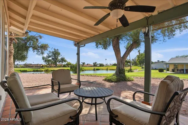 a bedroom with a bed a closet and large mirror